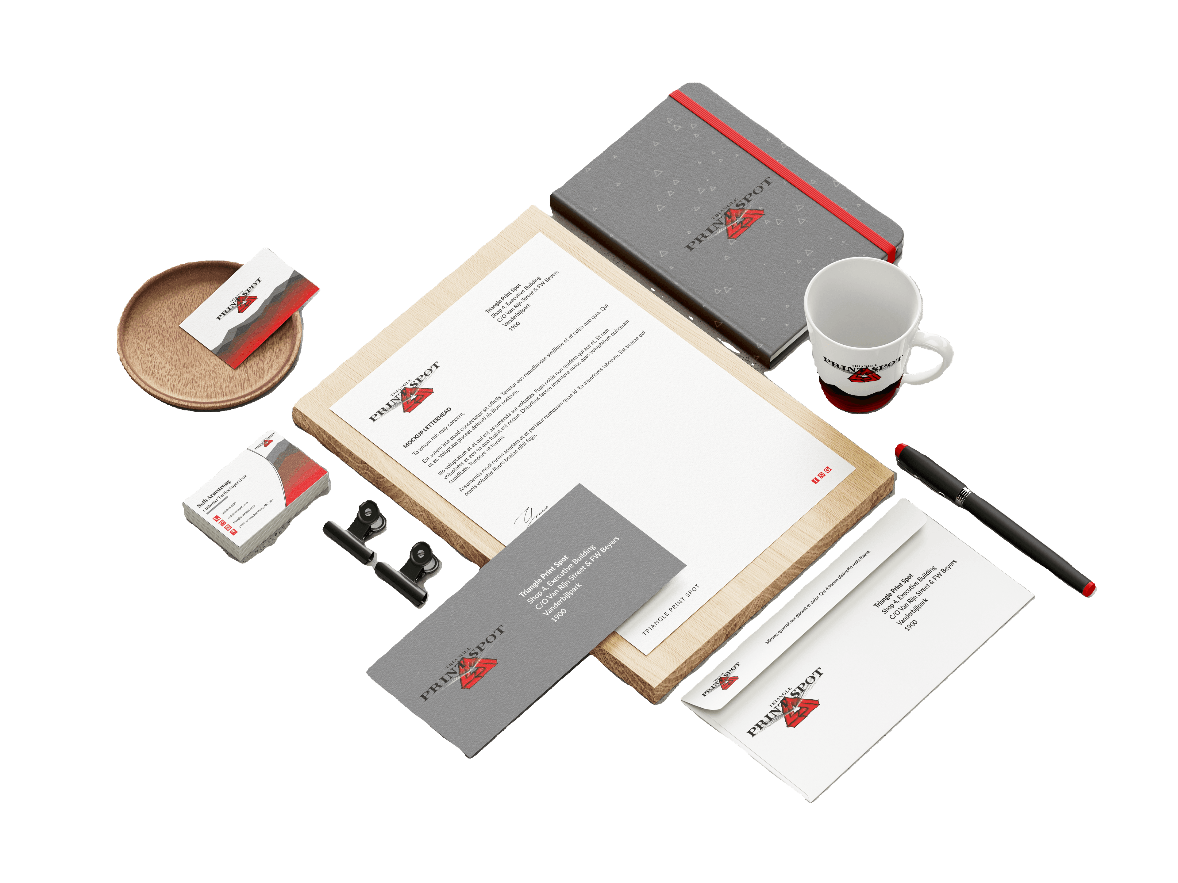 A collection of Triangle Print Spot designed business stationery and cards arranged on a blank background.